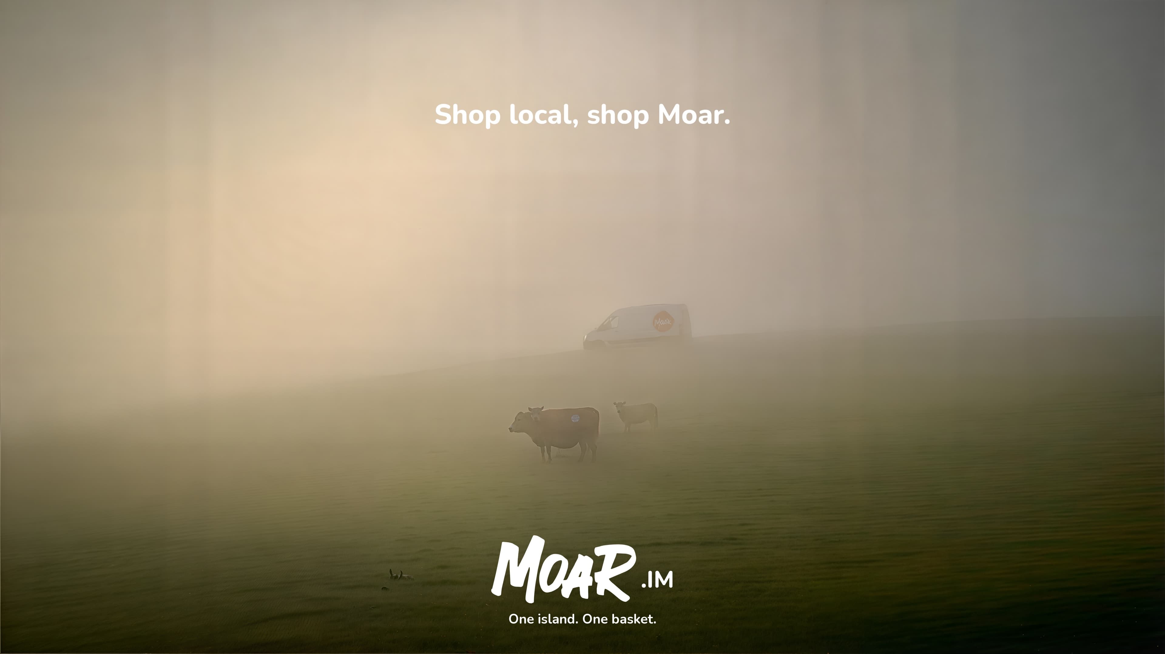 A MOAR delivery van on a foggy Isle of Man hillside above two grazing cows, beneath the line “Shop local, shop Moar.”